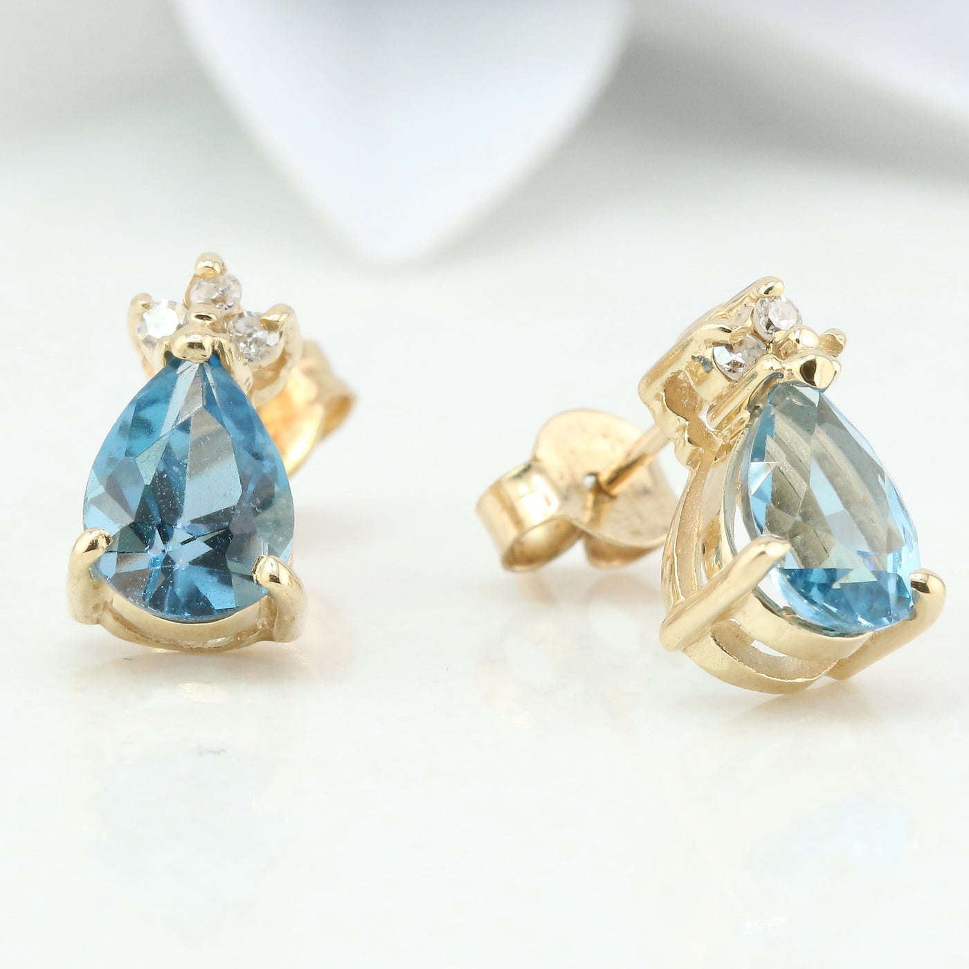 Blue topaz and diamond stud earring