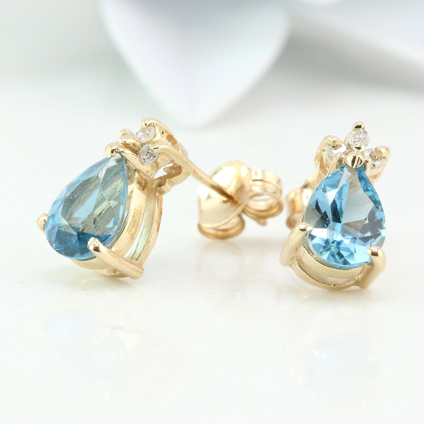 Blue topaz and diamond stud earring