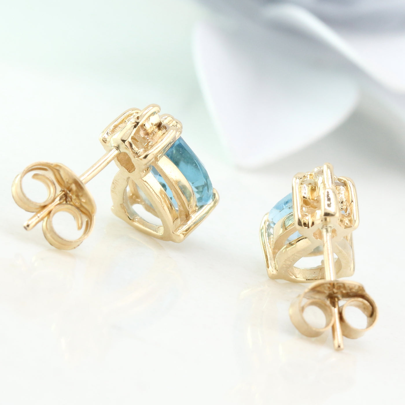 Blue topaz and diamond stud earring